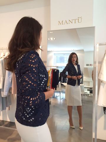 Woman standing in front of a mirror